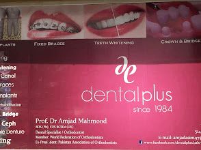 The Dental Plus signboard, reading 'dental plus since 1984', with Prof. Dr Amjad Mahmood's name and credentials and a list of treatments